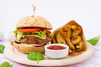 big-sandwich-hamburger-with-juicy-beef-burger-cheese-tomato-and-red-onion-and-french-fries